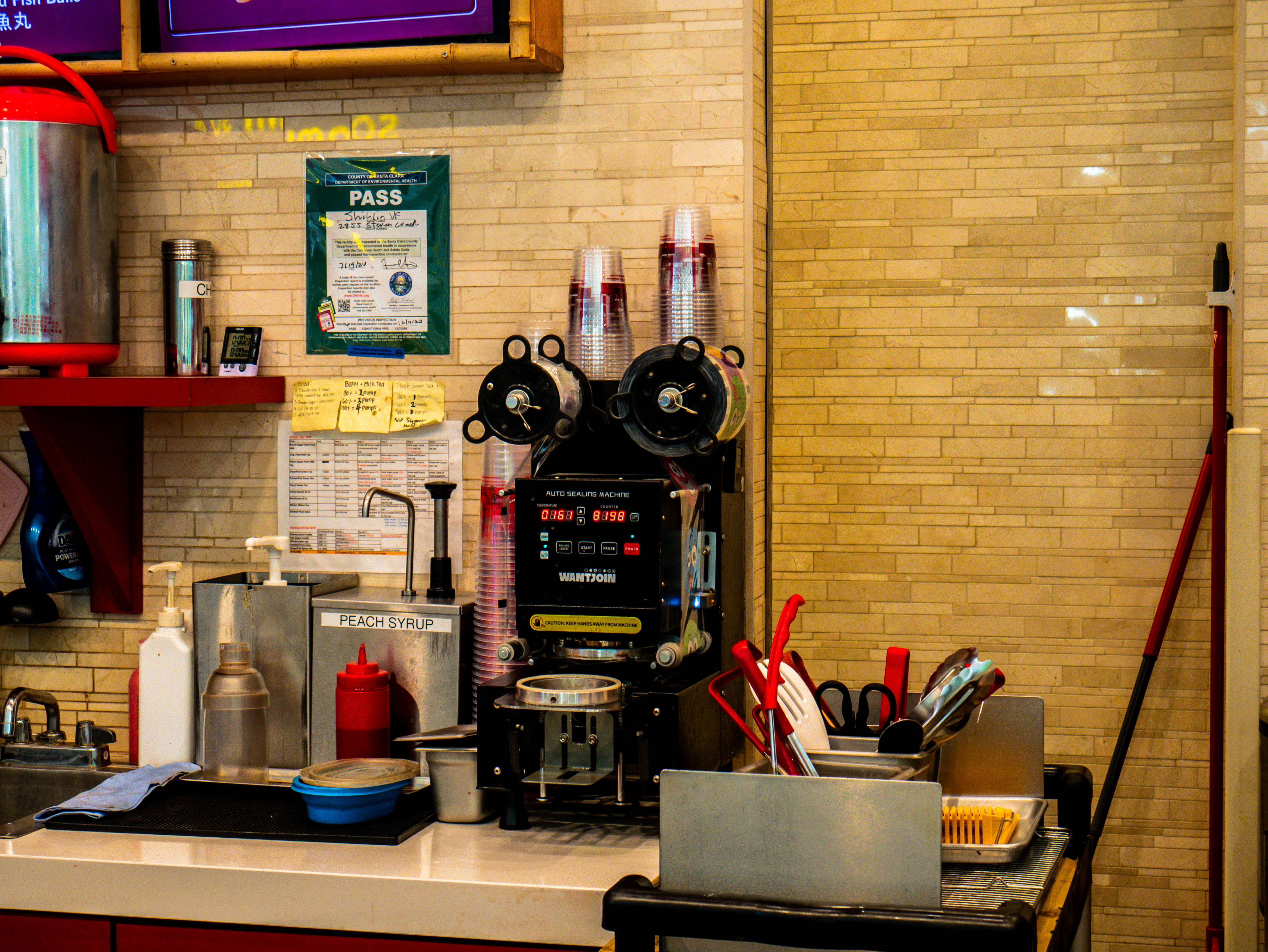 Beverage preparation station with professional equipment, ingredient storage, and efficient service design